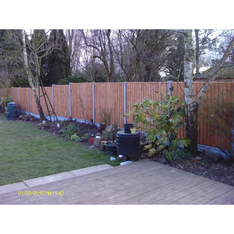 Newly installed garden fencing running along a rear garden border