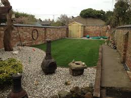 Neatly maintained lawn and gravelled garden after tidy-up